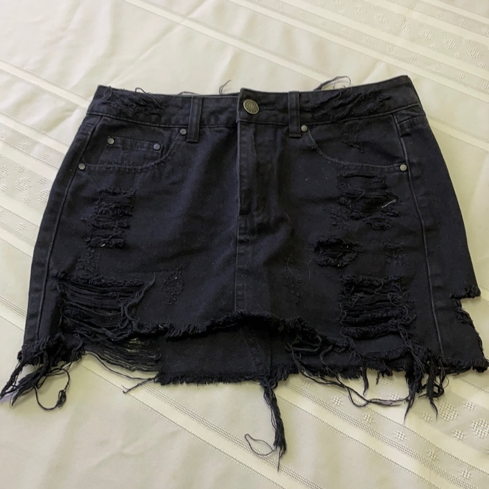 Black Denim distressed mini skirt.